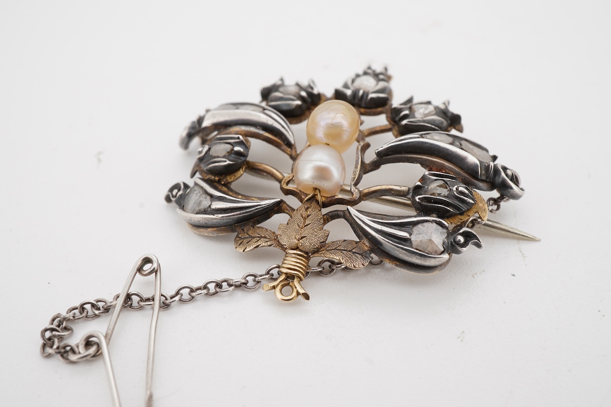 A yellow and white metal, pearl and rose cut diamond set bouquet brooch, width 36mm, pearls untested, with an associated Edward Tessier gilt tooled red leather fitted box.